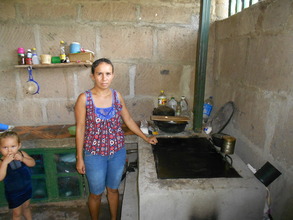Yakeni G. and her new improved cookstove!