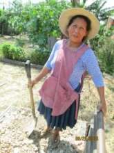 Ancelma shoveling gravel for her bathroom
