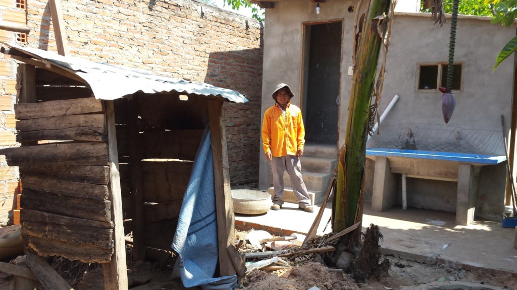 Almost done! Old pit latrine is in the foreground.