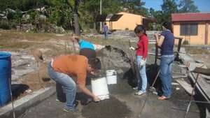 Teachers mixing morter