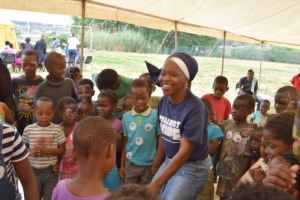HOPE Centre Staff member with children on WDD