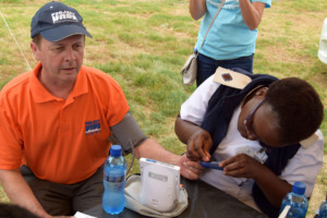 Dr. Kenyon, Project HOPE CEO, getting screened