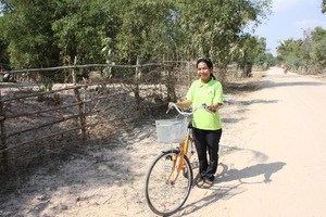 Sithea travels the local countryside by bicycle