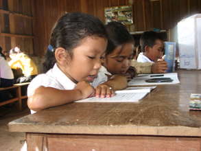 School girl learning to read