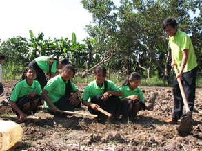 Young people learning how to grow vegetables