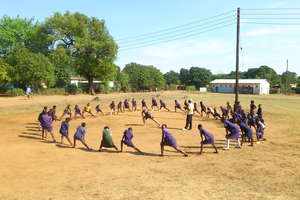 Our community sports volunteers leading a warm-up