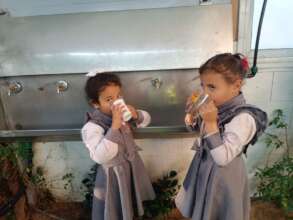 Girls in Gaza drinking clean water