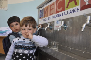 Preschool boys drink clean water