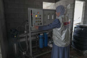 Checking the water purification unit at a hospital