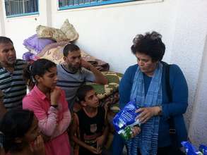Distributing food and hygiene kits at UN school