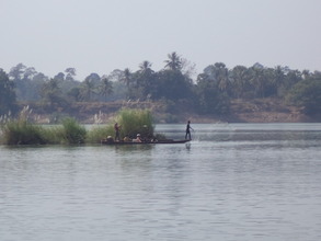 Villagers catch fish from the river for their food
