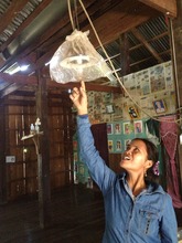 Ms. Rom showing her broken lamp