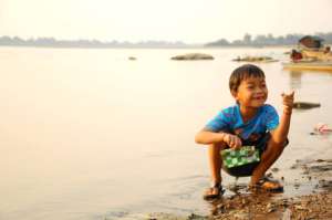 Child playing in the Mekong River