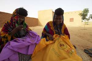 Naiwa & Bappa embroidering Wodaabe symbols.