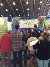 crowds watching a toy building demonstration