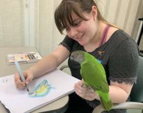 TALENTED VOLUNTEER TORI PAINTS OUR MANGO!