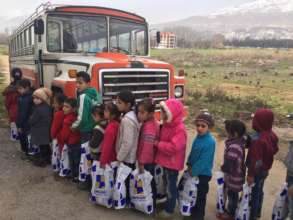 Children taking home their new winter clothes