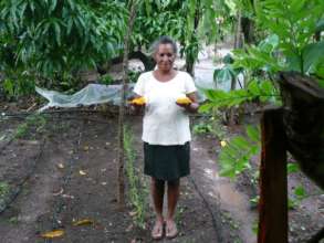 Dona Bertulia showing her crop.