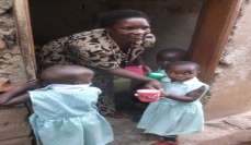 Mama Rachel serving porridge and eggs to kids.