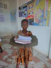 Receiving her first learning materials from TANF