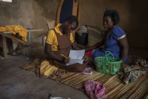 Nuela been assisted by her mum to do her homework