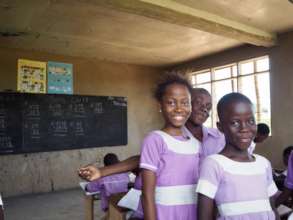 Benedicta happy in class with her class mates