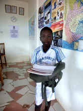 Ben receive his school materials in TANF Office.