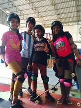 The girls in their gear, ready to skateboard