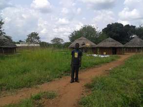 A teacher in front of teachers' accommodation.