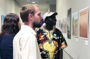 Ngor and friends view exhibit at Mint Museum