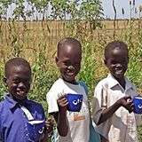 Children with food cups at Gumriak orphanage