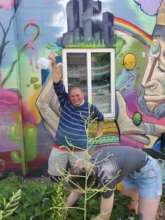 A volunteer having a great time at the gardens
