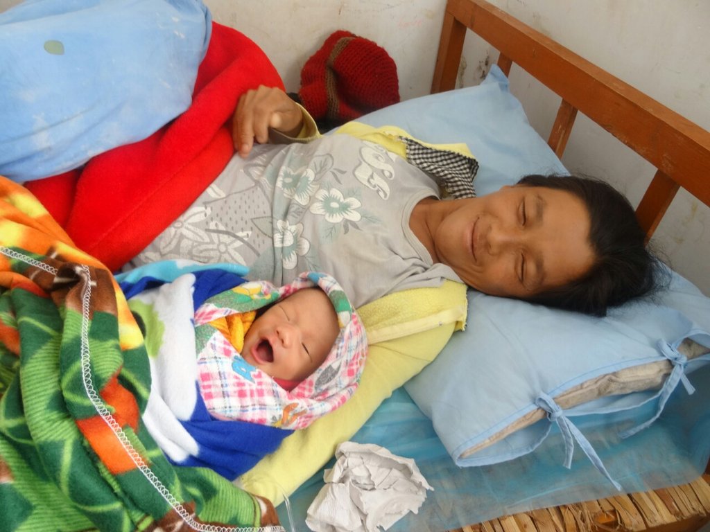 A healthy mother and child, post-C-section.