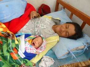 A healthy mother and child, post-C-section.