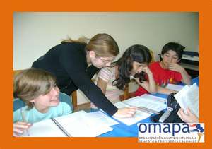 Teachers working with the kids of the first level