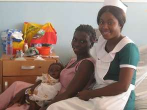 A nurse with a young patient and her mother