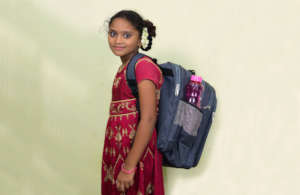 Posamma with her new backpack and supplies