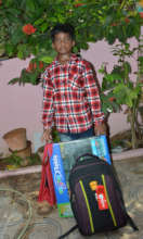 Samuel with his new school supplies