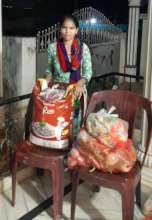 Sudharani with a food relief packet