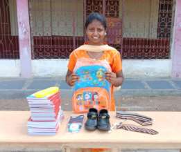 Bharathi with all her school supplies and uniform
