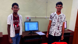 orphan boys with new computer