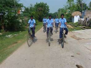 Children ride their bikes to school