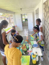Children Painting At the July/ August Programme