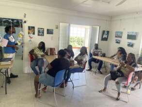 Teachers Listening to a presentation on composting