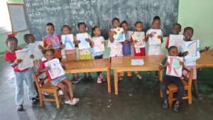 Chilren from Georgetown showing off their books