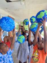 The children proudly displaying their Planet Earth