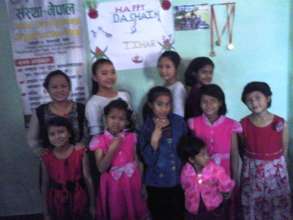 Children happy with their new dresses.