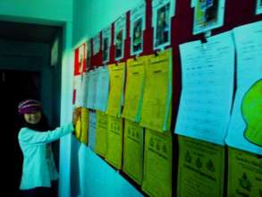 PRIYA,Class-7 happy with displayboard at childhome