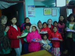 Children happy with gifts from JAN and TONY.