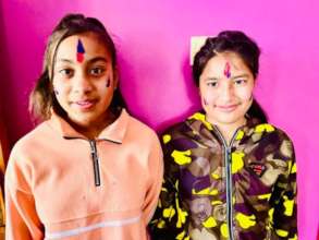 Saraswati and Karisma celebrating Holi with colors